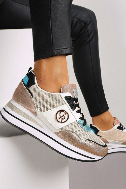 Champagne fashion sneakers with decorative detail, featuring stylish design and comfortable fit