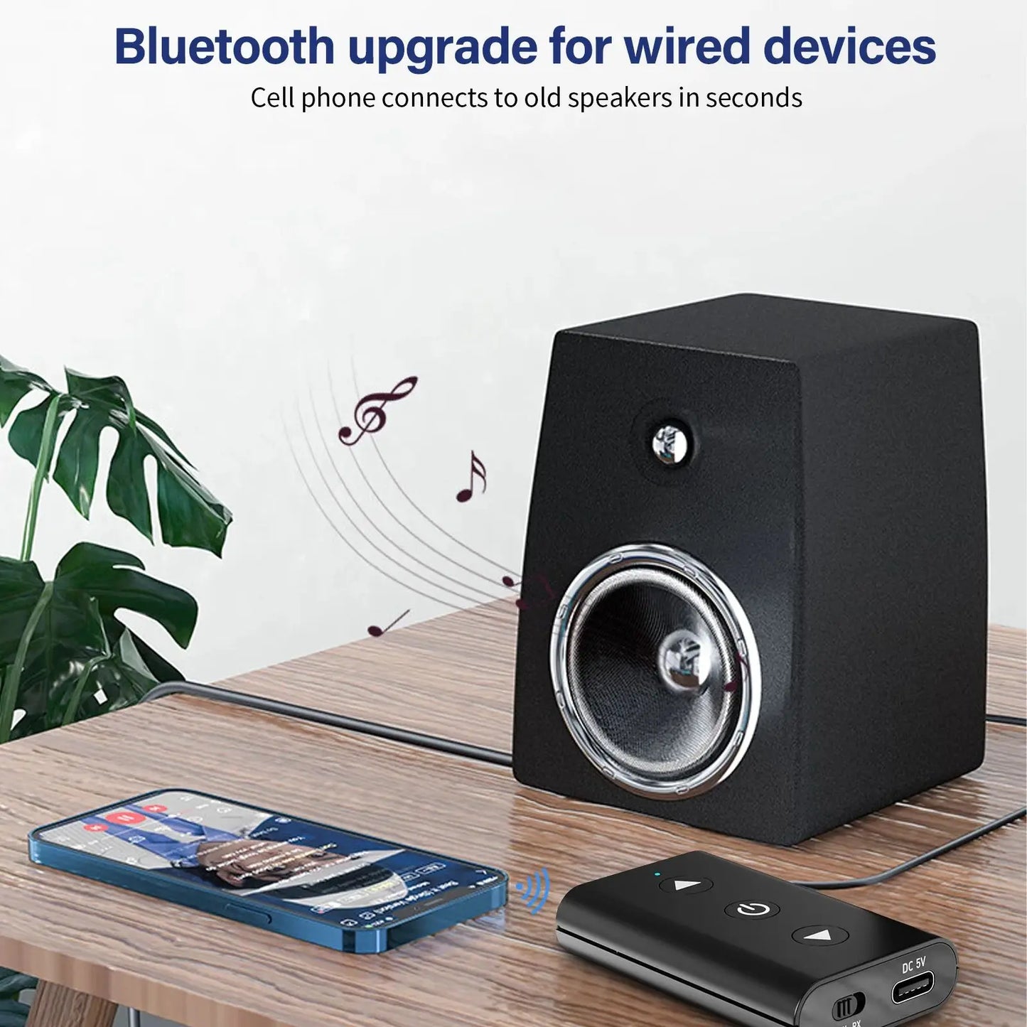 Shophouse Northwest portable wireless bluetooth audio adapter next to smartphone and wired speaker showing wireless streaming