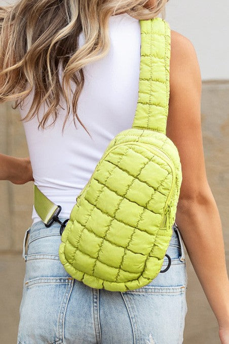 Skyler puffer sling bag by Shophouse Northwest in lime green quilted crossbody design for hands free wear