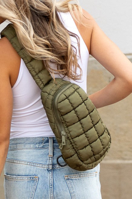 Shophouse Northwest Skyler puffer sling bag olive quilted crossbody worn on back with adjustable strap