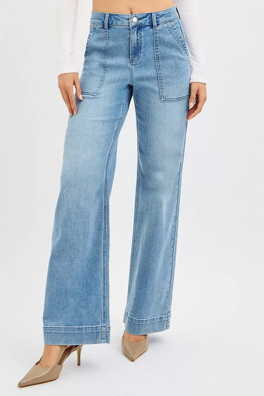 Light wash plus size high rise straight leg jeans with pockets and wide leg style
