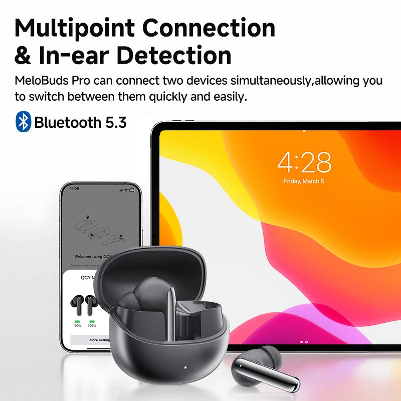 Shophouse Northwest QCY MeloBuds Pro ANC earbuds black with open charging case and one earbud beside phone and tablet