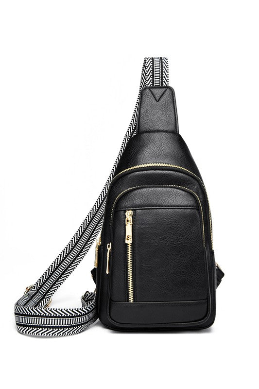 Shophouse Northwest Genevive leather sling crossbody bag black pebbled leather with gold zippers and wide patterned strap