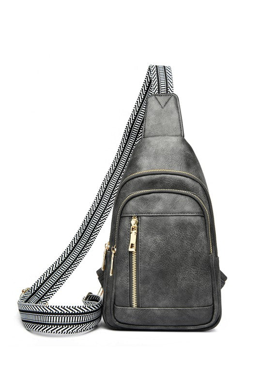 Genevive leather sling crossbody bag in gray with gold zippers and black white chevron strap by Shophouse Northwest