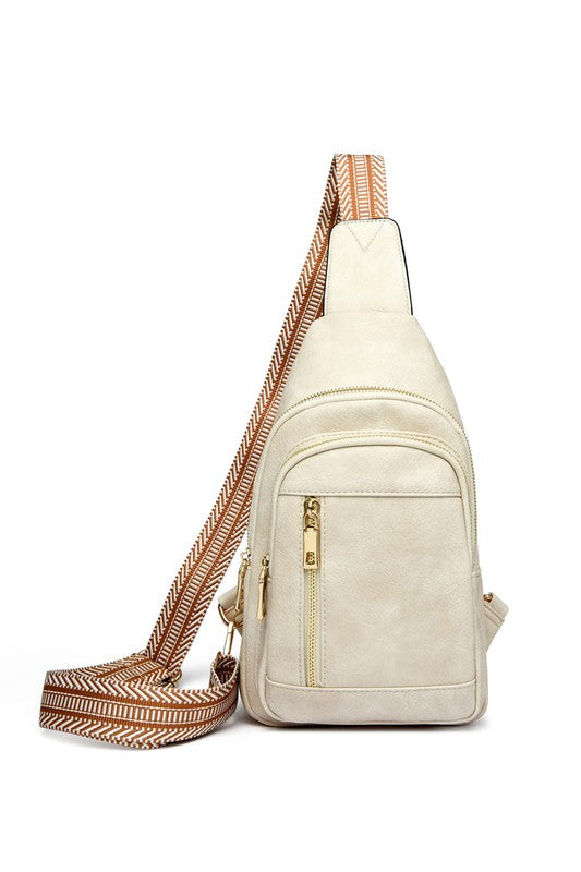 Shophouse Northwest Genevive leather sling crossbody bag in cream with striped adjustable strap and gold zippers