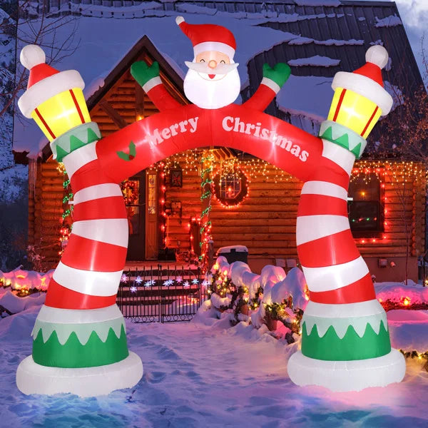 Lighted Christmas inflatable archway with Santa and festive striped columns for holiday decorations