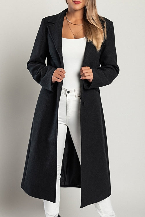 Stylish black long coat for women with button closure and tailored fit, perfect for winter outfits