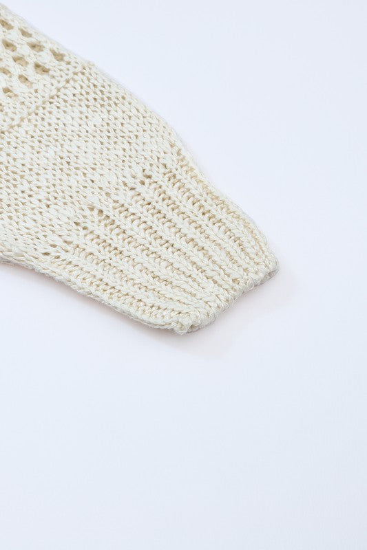 Shophouse Northwest cream crochet dolman cardigan sleeve close up showing ribbed cuff and openwork stitch