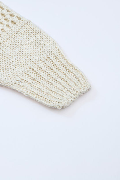 Shophouse Northwest cream crochet dolman cardigan sleeve close up showing ribbed cuff and openwork stitch