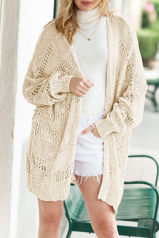 Shophouse Northwest cream crochet dolman cardigan open knit oversized layering over white turtleneck and cutoff shorts