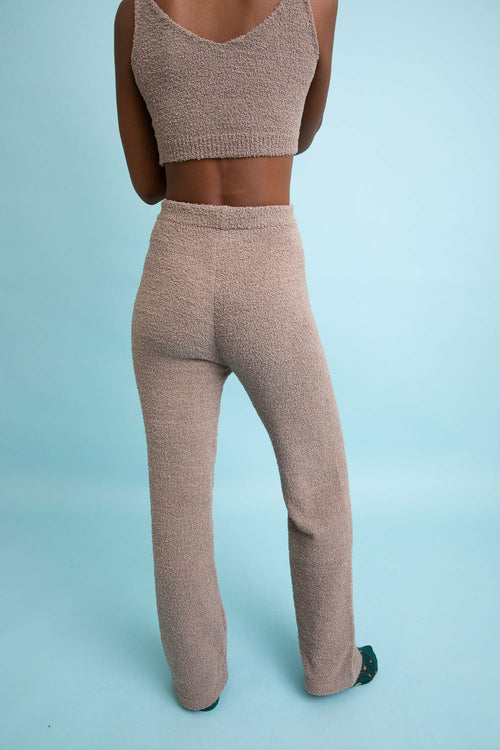 Back view of beige boucle lounge pants from Shophouse Northwest with a cozy fit and flared legs