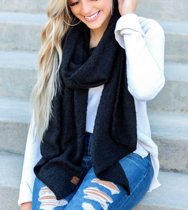 Shophouse Northwest wearing cc cozy draped oversized scarves for women black knit scarf over white sweater and ripped jeans