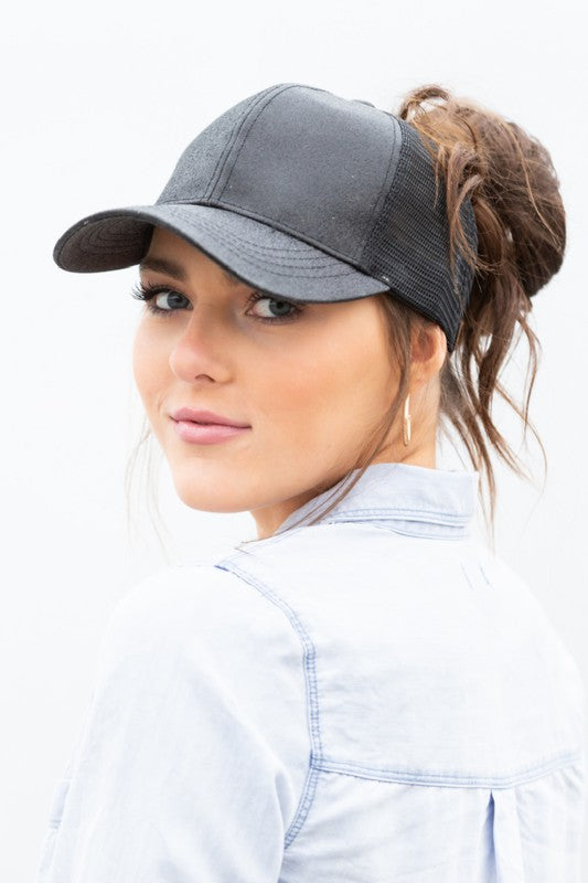 Shophouse Northwest CC glitter messy bun hat charcoal mesh trucker cap worn by model with high messy bun