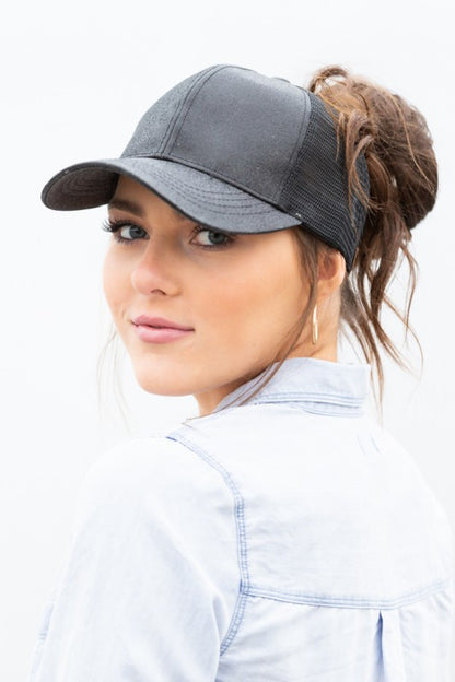 Shophouse Northwest CC glitter messy bun hat charcoal mesh trucker cap worn by model with high messy bun