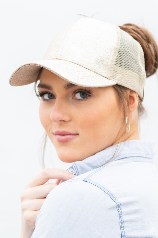 CC glitter messy bun hat beige glitter trucker with mesh back modeled by woman wearing casual outfit