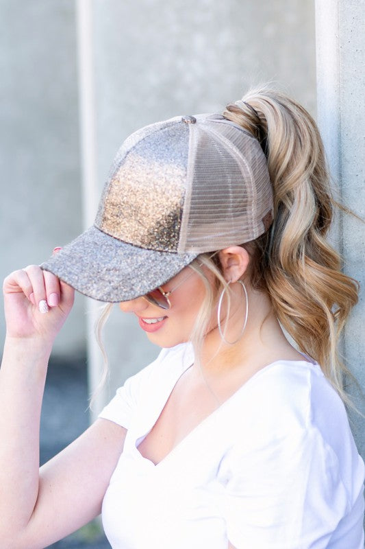 CC glitter messy bun hat gold glitter trucker cap with mesh back worn with high ponytail Shophouse Northwest