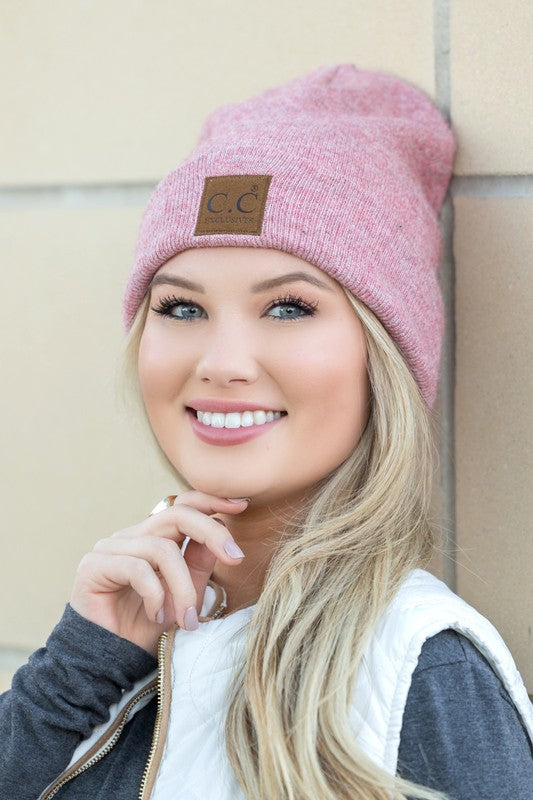 CC heathered boyfriend beanie on smiling blonde woman in pink knit hat with leather CC patch