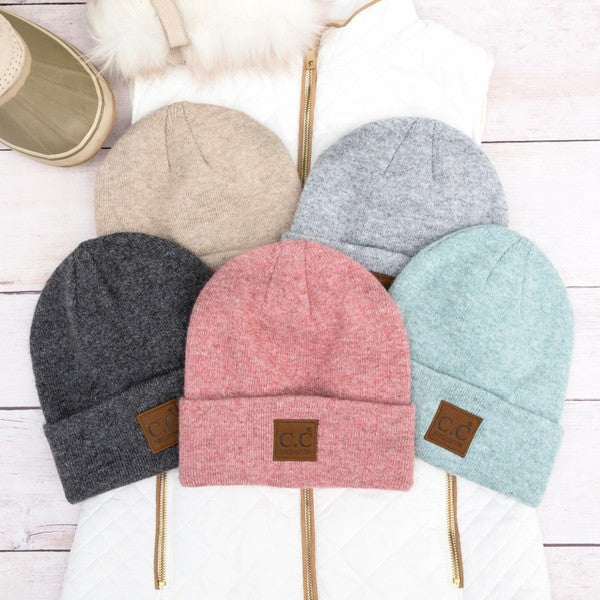 Shophouse Northwest CC heathered boyfriend beanie six color display with charcoal, tan, gray, pink, mint on quilted jacket