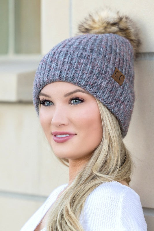 Shophouse Northwest CC marled pom beanie gray marled knit with faux fur pom and leather CC patch on model