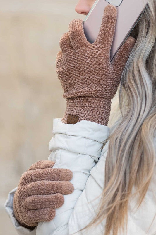 Shophouse Northwest brown chenille touch screen gloves worn by woman using smartphone in winter coat