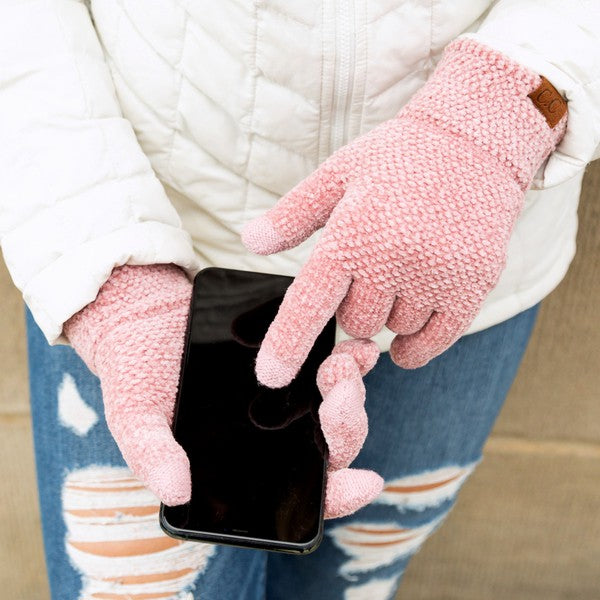 Shophouse Northwest pink chenille touch screen gloves worn using smartphone with white jacket and ripped jeans