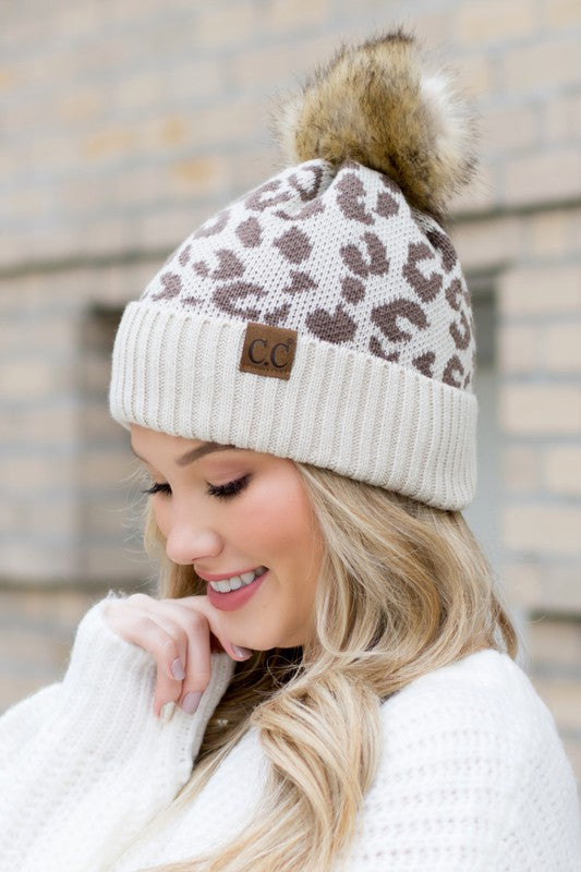 Shophouse Northwest leopard fur knit pom beanie cream and brown leopard print knit with faux fur pom on model