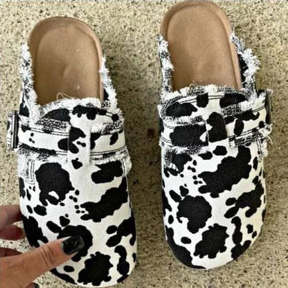 Shophouse Northwest comfortable slip on clogs for women in black and white cow print design