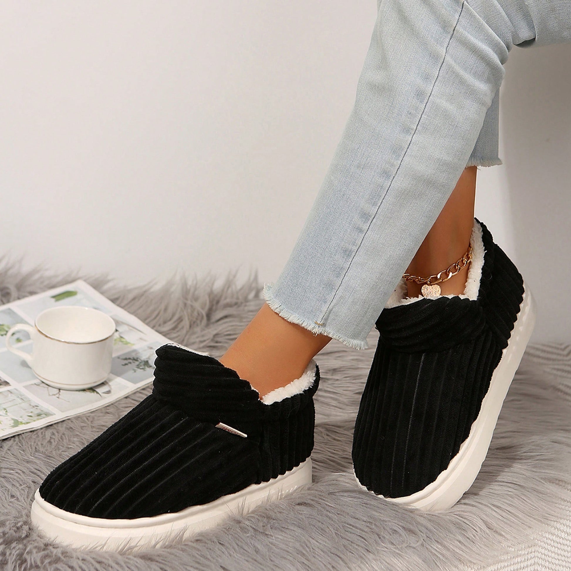 Jumpstudios-BTG cozy indoor house slippers in black with plush lining for ultimate comfort
