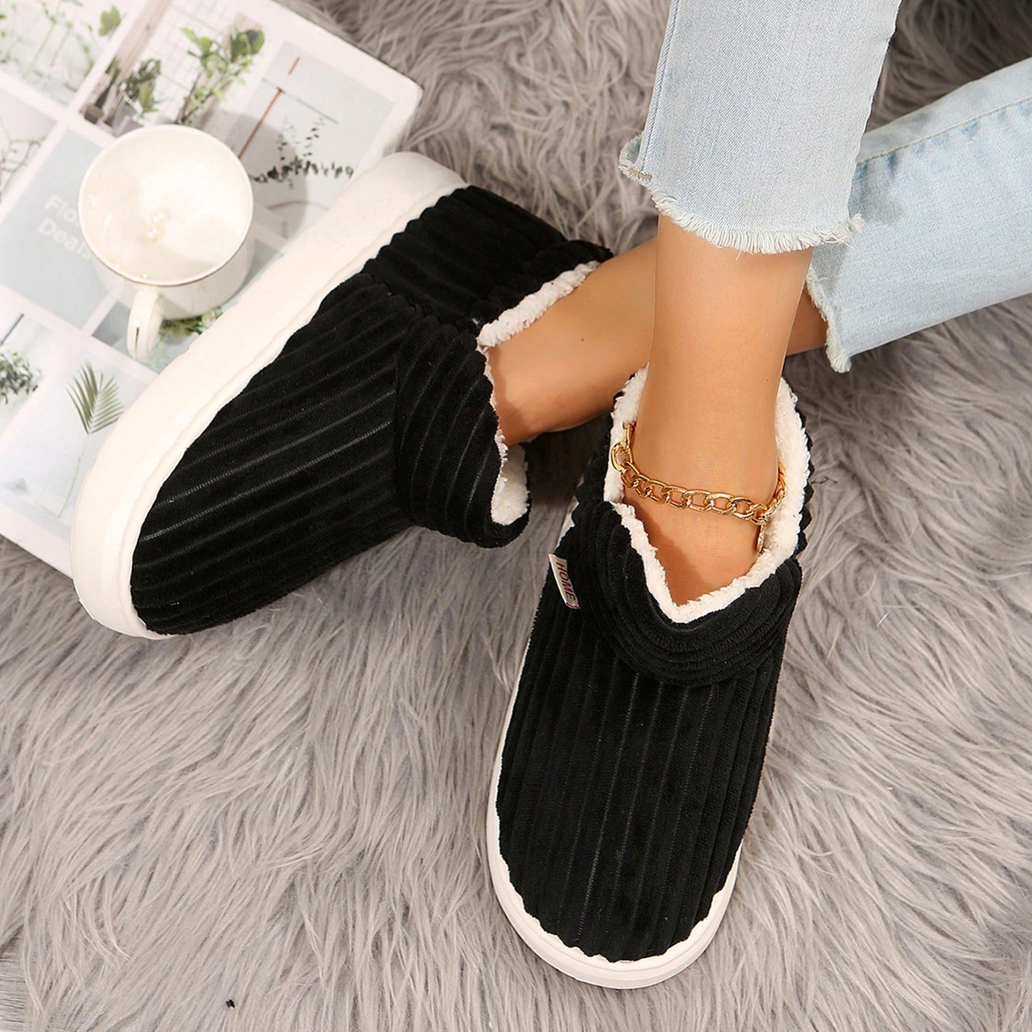 Cozy indoor house slippers by Jumpstudios-BTG in black with plush lining for comfortable wear