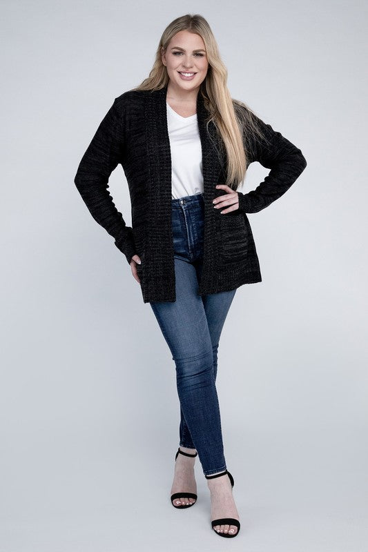 Shophouse Northwest plus size open front cardigan black knit worn by smiling model with jeans and heels