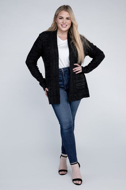 Shophouse Northwest plus size open front cardigan black knit worn by smiling model with jeans and heels