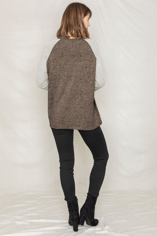 Shophouse Northwest plus size two tone raglan tunic brown body light gray quilted sleeves with black jeans and ankle boots