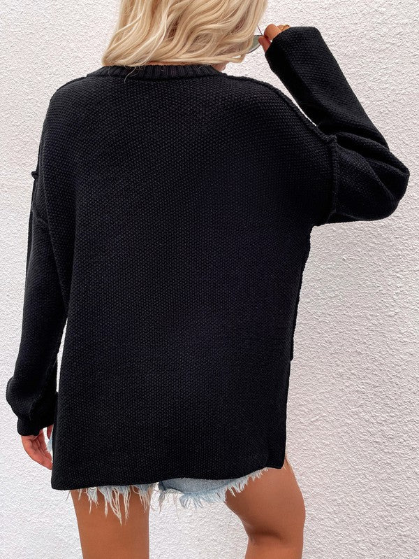 Shophouse Northwest black women's long sleeve loose sweater knit oversized back view with denim shorts