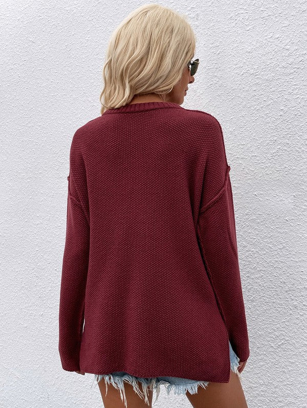 Shophouse Northwest women's long sleeve loose sweater burgundy knit oversized back view on model with denim shorts