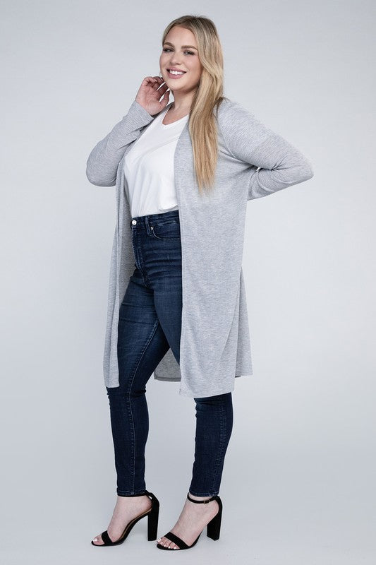 Shophouse Northwest model wearing plus size everyday comfy cardigan in light gray over white tee with dark jeans and heels