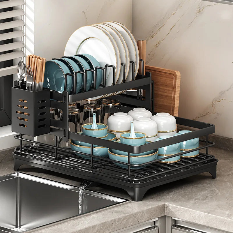 Double layer kitchen drying rack with plates, cups, and utensils drying on a stylish countertop