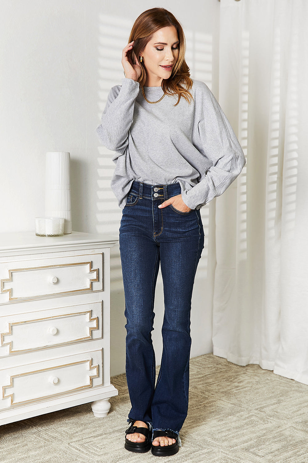 Trendsi double take seam detail top in gray paired with flared jeans for a stylish look