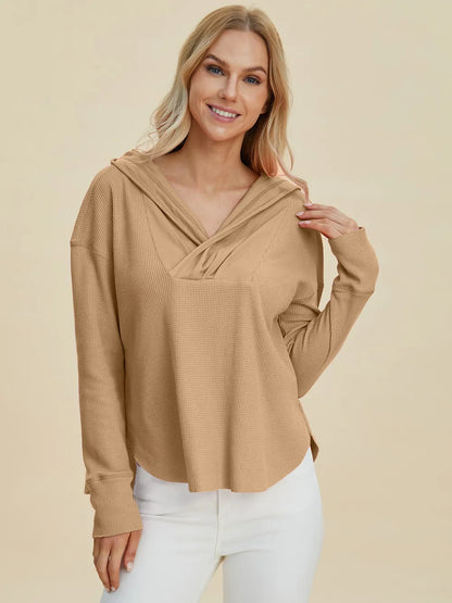 Trendsi dropped shoulder high-low hoodie in beige with a stylish V-neck design for a trendy look