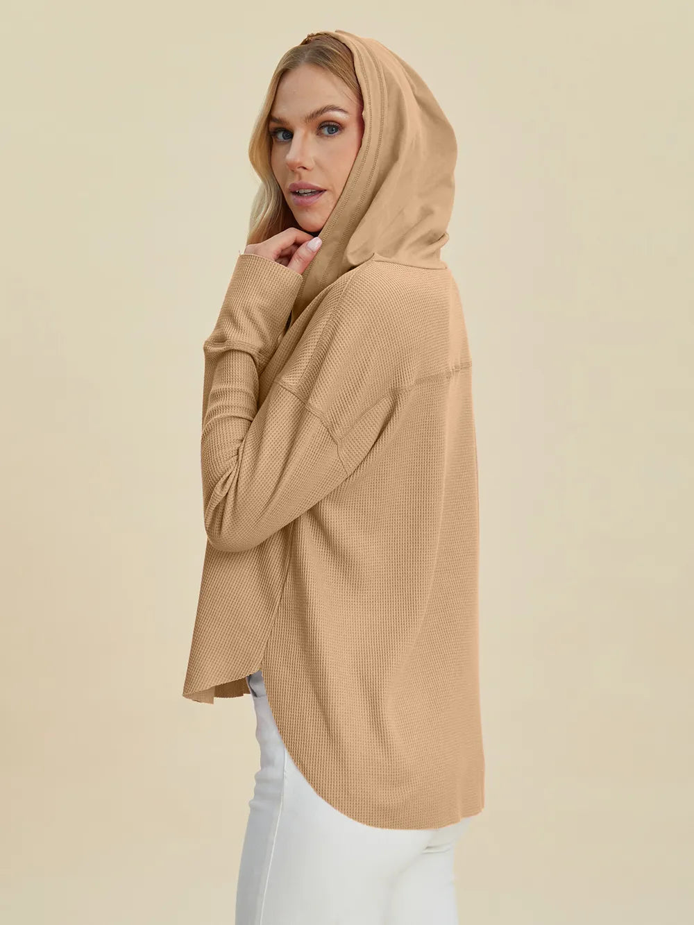 Trendsi dropped shoulder high-low hoodie in soft beige with a stylish hood for a comfortable, trendy look