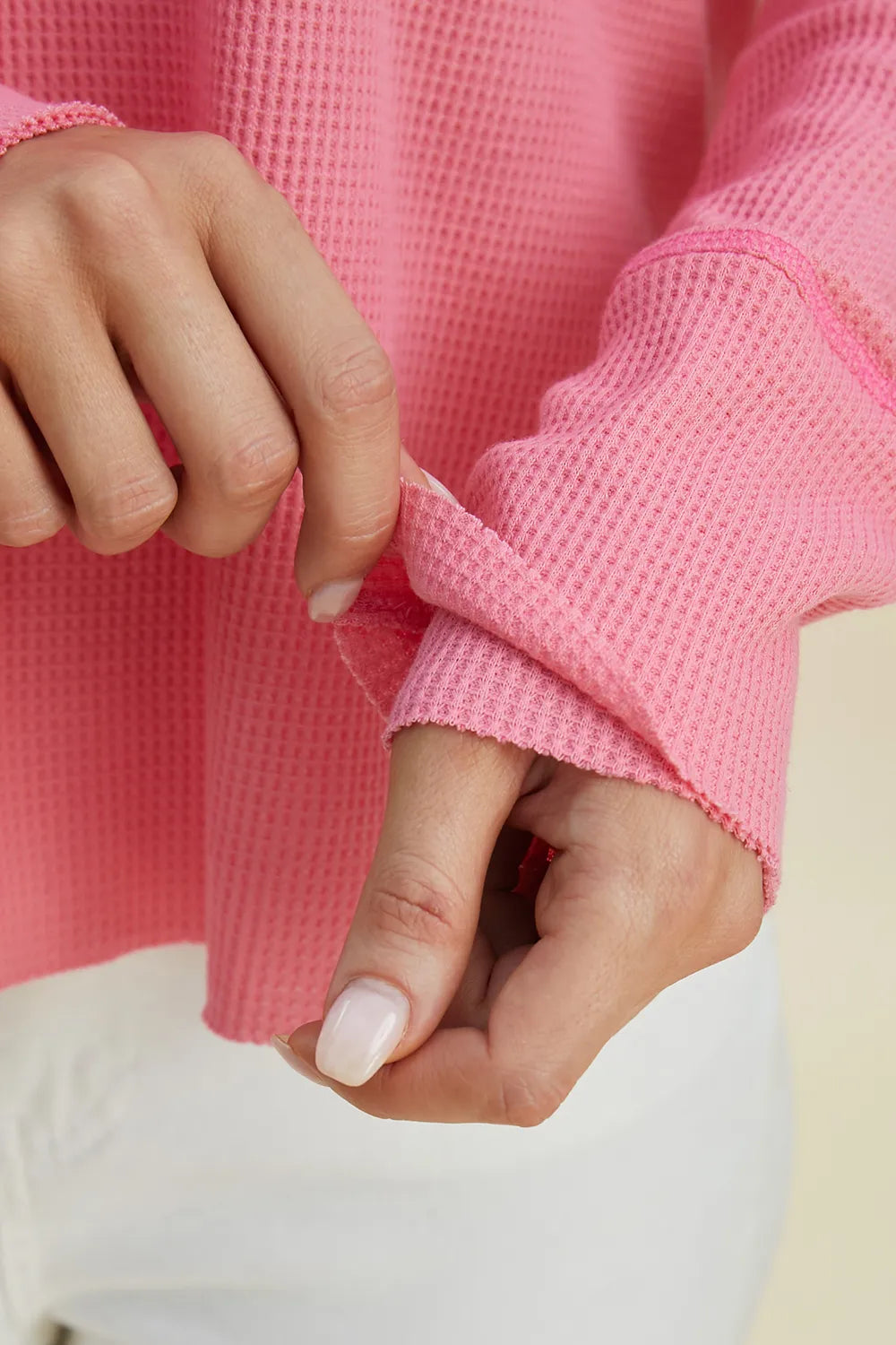 Trendsi dropped shoulder high-low hoodie in pink, featuring a textured fabric and relaxed fit