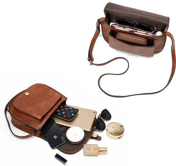 Shophouse Northwest brown leather foldover buckle crossbody bag with pockets holding phone wallet sunglasses and cosmetics