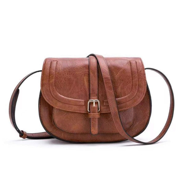 Shophouse Northwest brown leather foldover buckle crossbody bag saddle style with adjustable strap