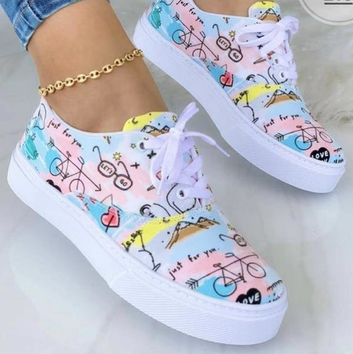 Colorful fashion graffiti trainer sneakers featuring playful bike and heart designs for a trendy look