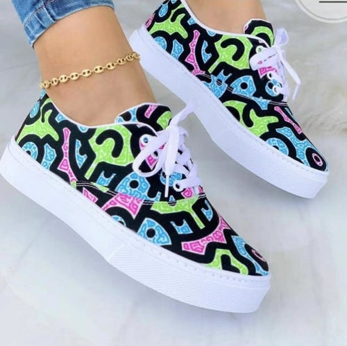 Colorful fashion graffiti trainer sneakers with bold designs and white soles perfect for trendy outfits