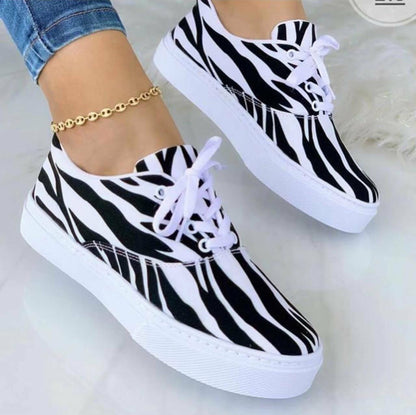 Stylish fashion graffiti trainer sneakers in black and white zebra print design for trendy looks