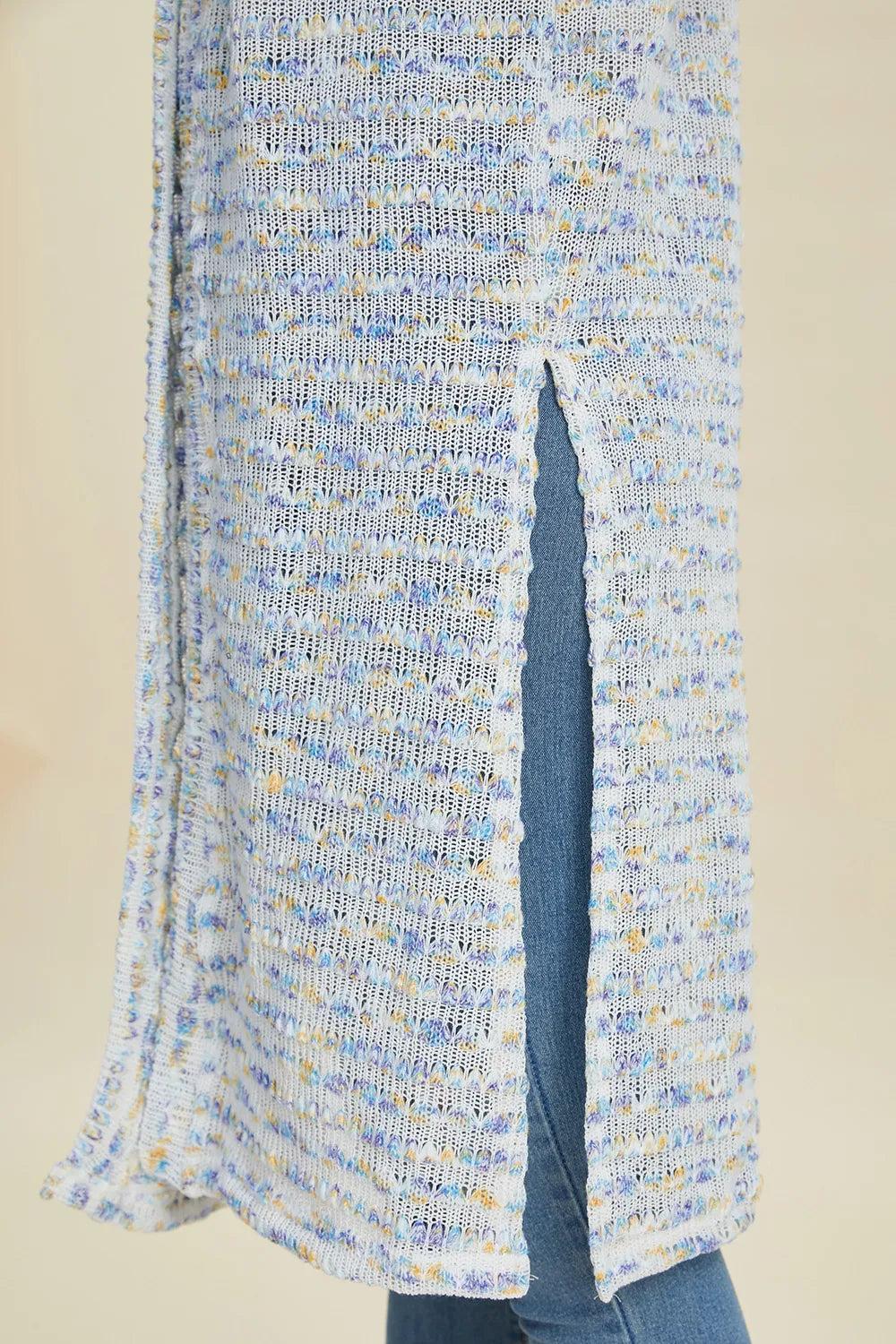 Light blue full size cardigan sweater with a textured pattern and side slit detail