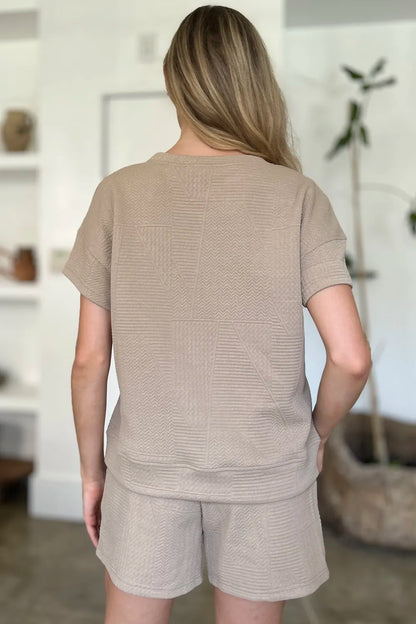 Back view of a beige full size textured short set perfect for casual summer outings