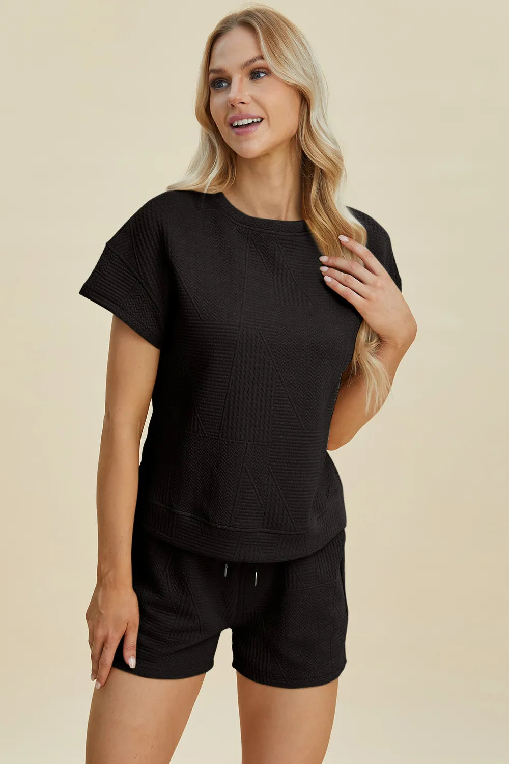 Trendsi full size textured short set in black with a stylish short sleeve top and matching shorts