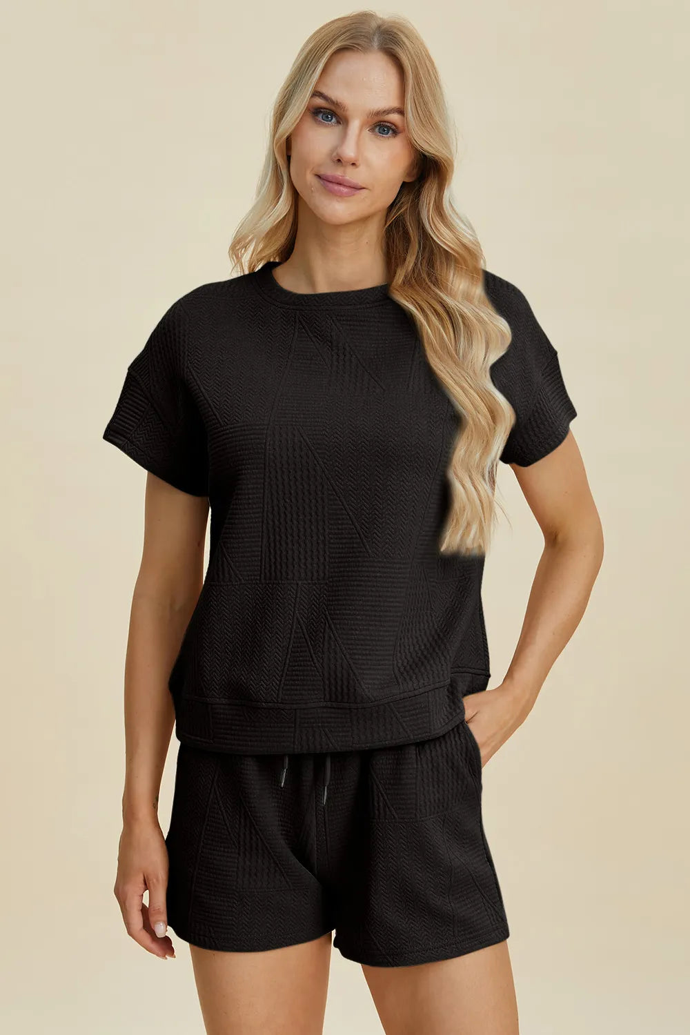 Trendsi full size textured short set in black featuring a stylish top and matching shorts