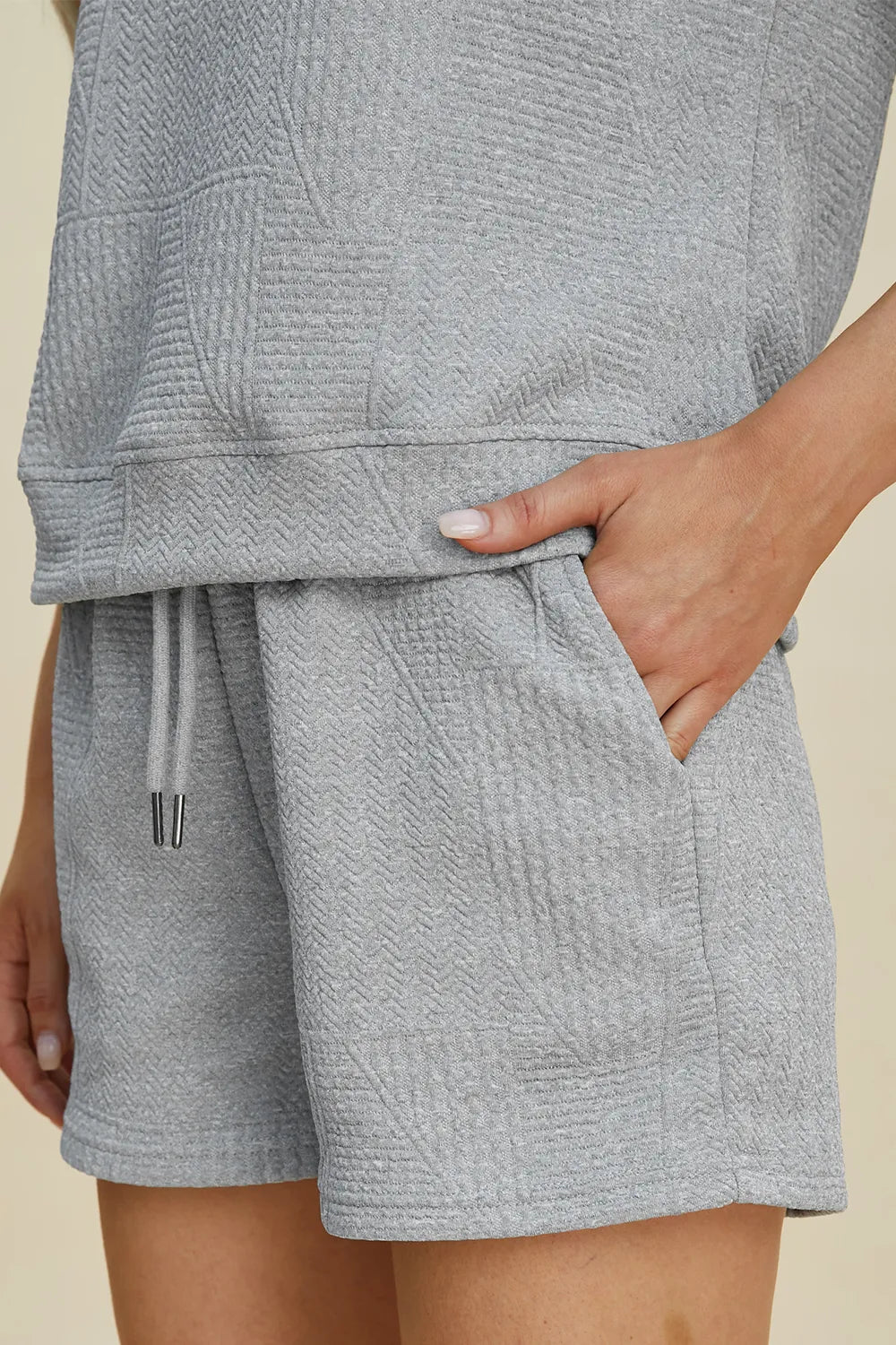 Trendsi full size textured short set in light gray, featuring a relaxed top and shorts with pockets